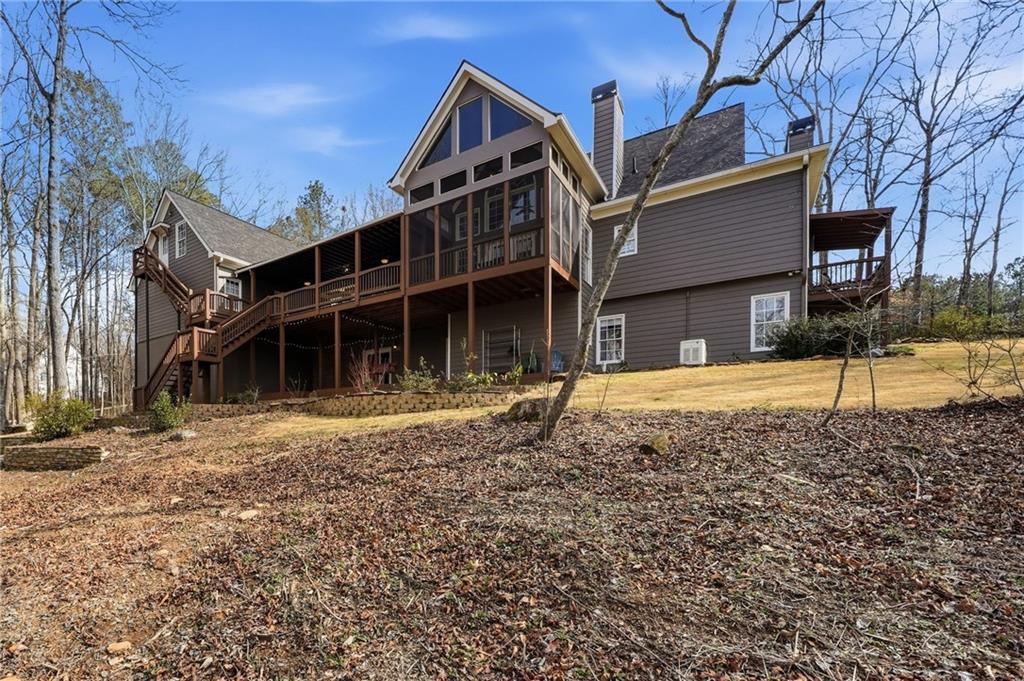 217 Wild Turkey Ridge Ball Ground, GA 30107 - Photo 50 of 55 a view of a house with a yard