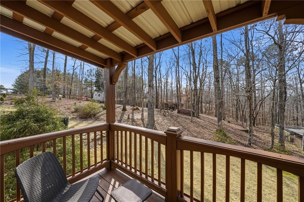 217 Wild Turkey Ridge Ball Ground, GA 30107 - Photo 9 of 55 a view of a two chairs in the balcony