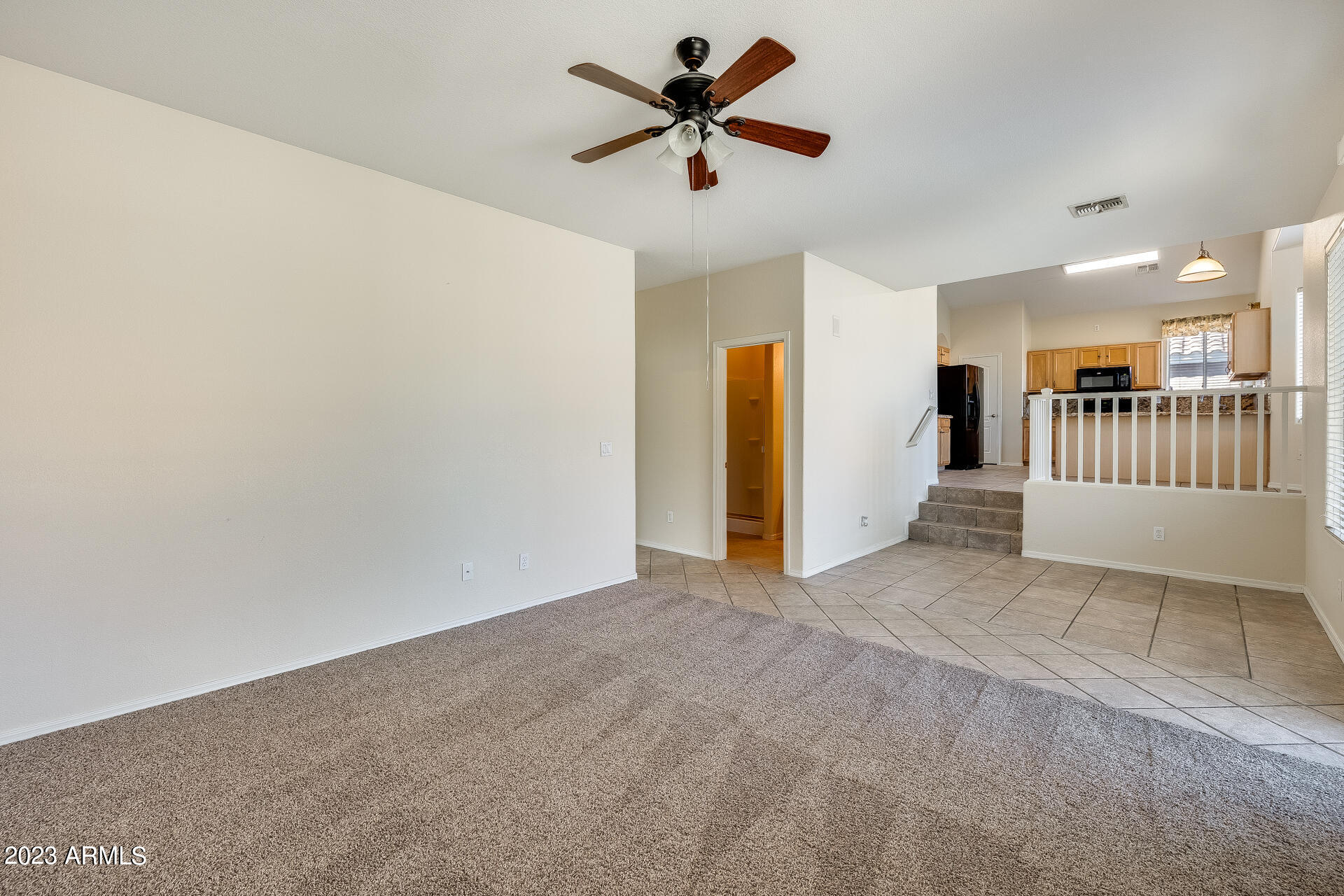 3244 West Maldonado Road Phoenix, AZ 85041 - Photo 19 of 43 a view of a livingroom with a ceiling fan