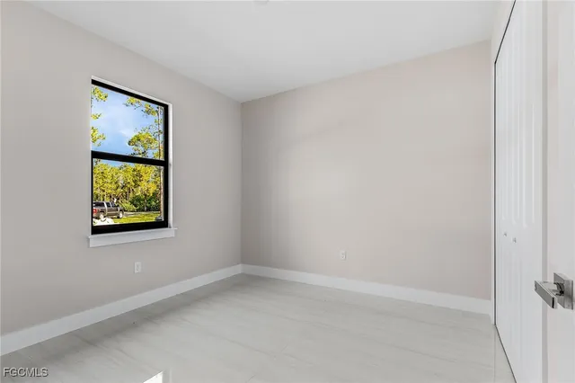 an empty room with windows