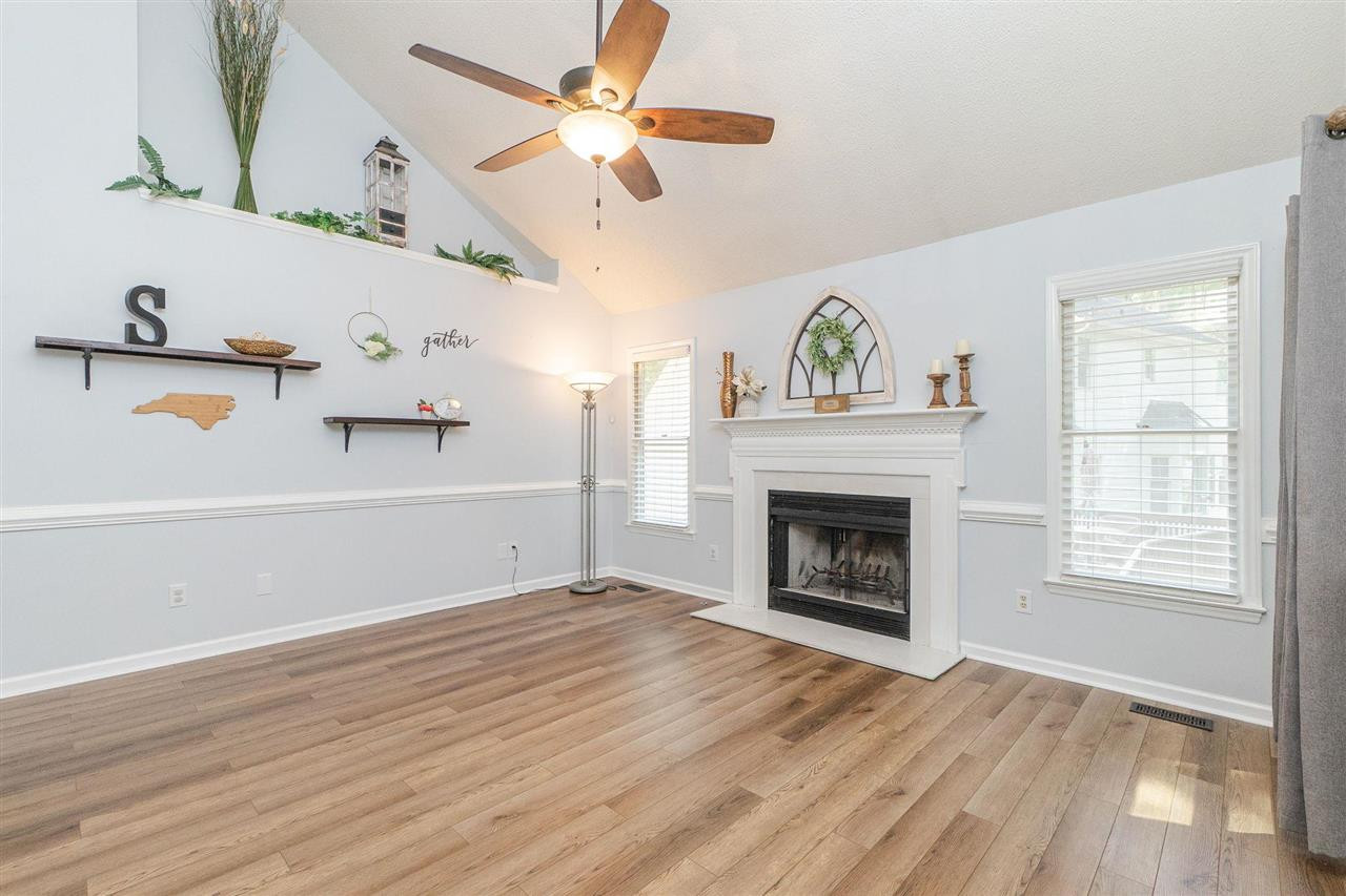 3 Bay Ridge Court Durham, NC 27707 - Photo 8 of 25 Separate family room with cozy fireplace.