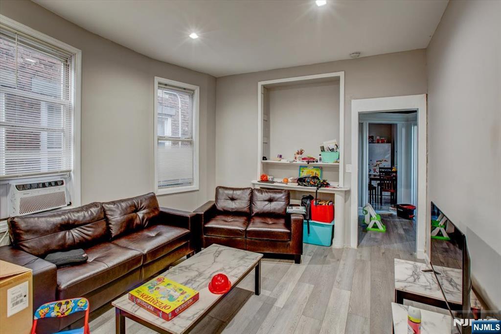 70 South 9th Street Newark, NJ 07107 - Photo 22 of 29 a living room with furniture and a wooden floor
