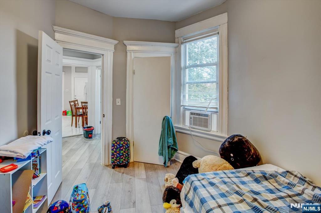 70 South 9th Street Newark, NJ 07107 - Photo 27 of 29 a bedroom with a bed and a window