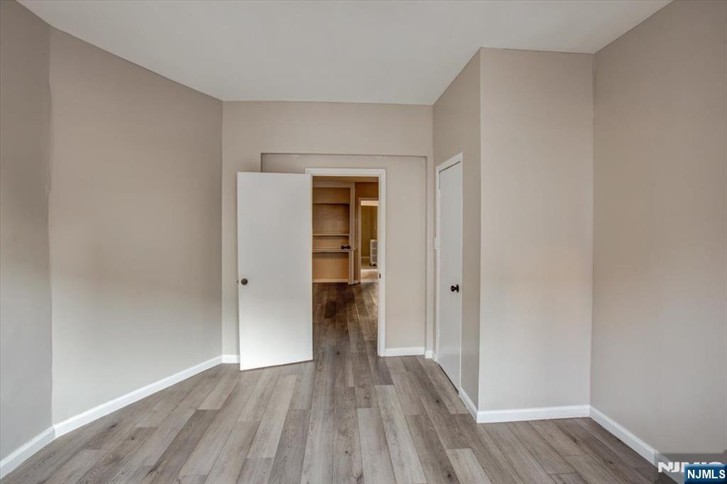 70 South 9th Street Newark, NJ 07107 - Photo 8 of 29 a view of a hallway with wooden floor