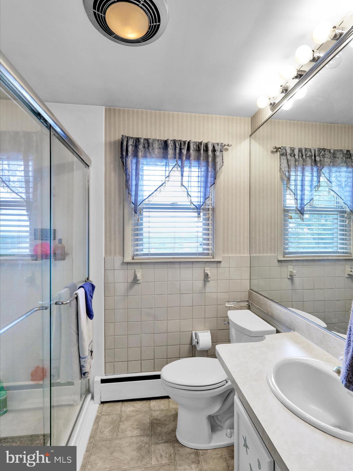1100 Old Fritztown Road Reading, PA 19608 - Photo 14 of 34 a bathroom with a toilet sink vanity granite and mirror