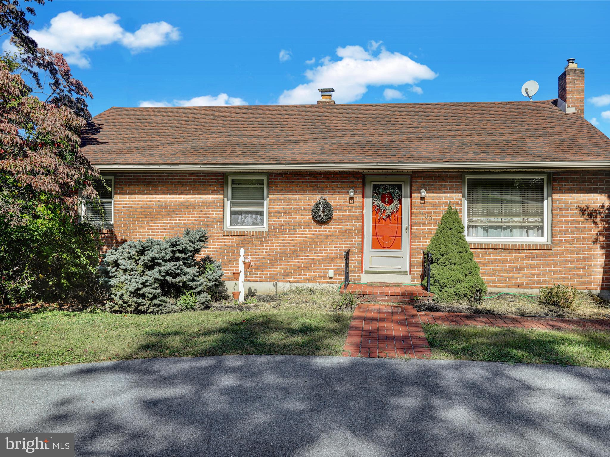 1100 Old Fritztown Road Reading, PA 19608 - Photo 2 of 34 a front view of a house with a yard and garage