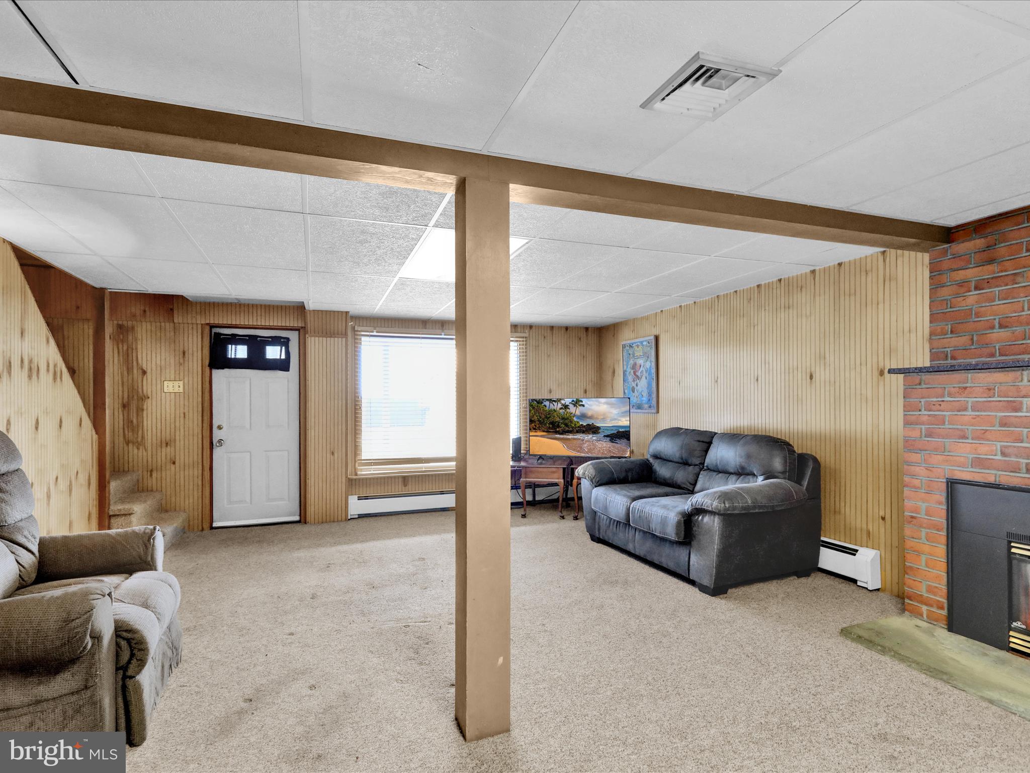 1100 Old Fritztown Road Reading, PA 19608 - Photo 22 of 34 a living room with furniture and a fireplace