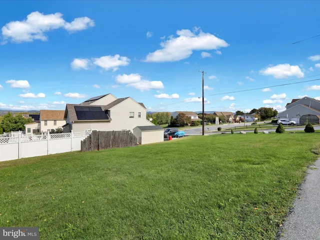 a view of a house with a street
