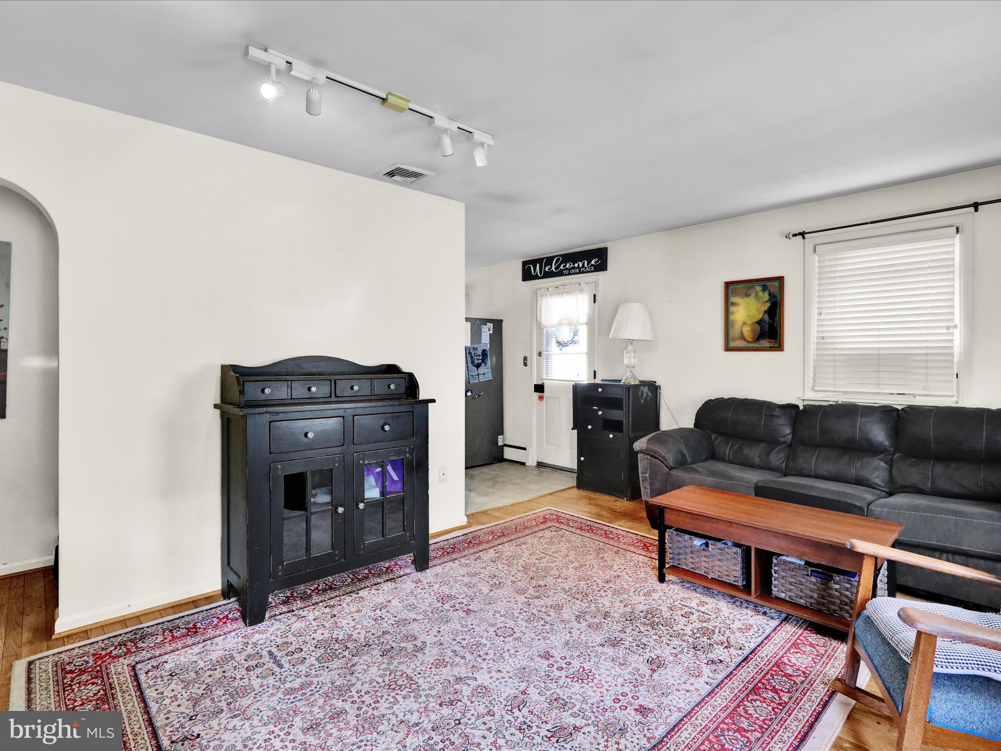1100 Old Fritztown Road Reading, PA 19608 - Photo 8 of 34 a living room with furniture a flat screen tv and a rug
