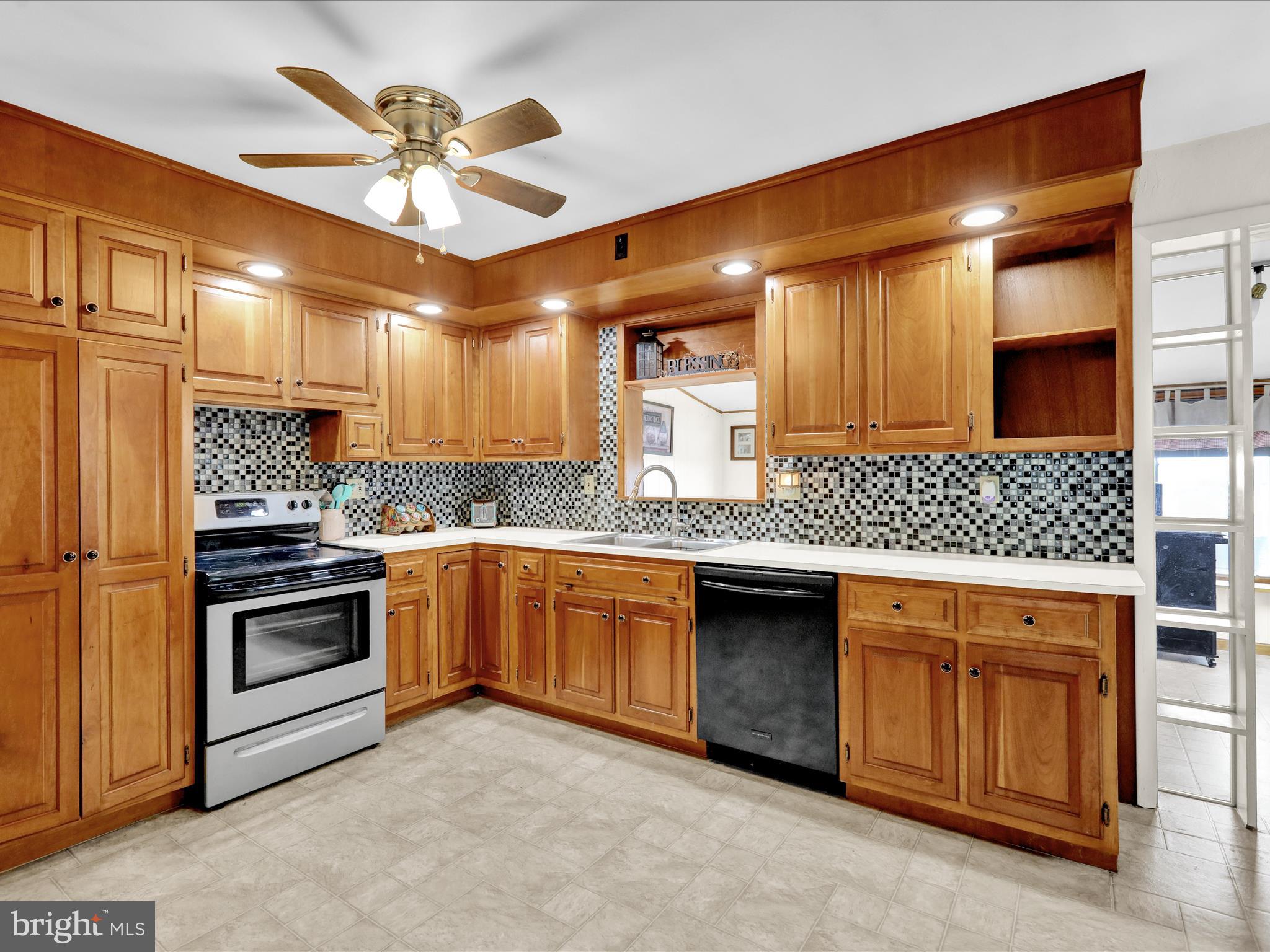 1100 Old Fritztown Road Reading, PA 19608 - Photo 9 of 34 a kitchen with granite countertop a sink stainless steel appliances and cabinets