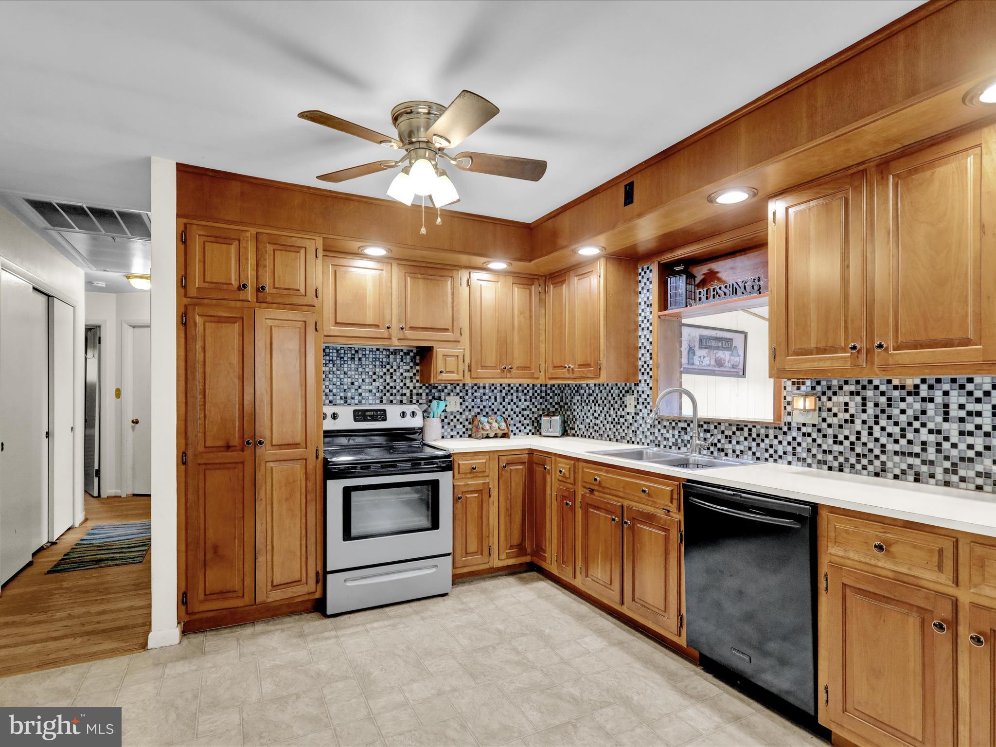 1100 Old Fritztown Road Reading, PA 19608 - Photo 10 of 34 a kitchen with stainless steel appliances granite countertop a sink and stove