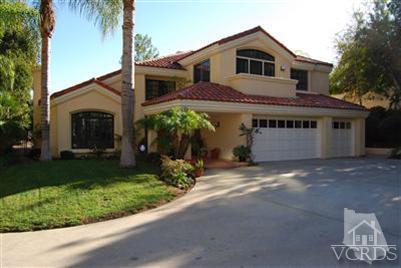 Undisclosed Address Calabasas, CA 91302 - Photo 1 of 10 a front view of a house with a garden