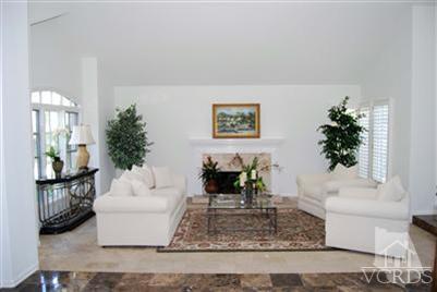Undisclosed Address Calabasas, CA 91302 - Photo 3 of 10 a living room with furniture and a potted plant