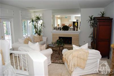 Undisclosed Address Calabasas, CA 91302 - Photo 6 of 10 a living room with furniture and a fireplace