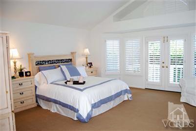 Undisclosed Address Calabasas, CA 91302 - Photo 8 of 10 a bedroom with a bed and window