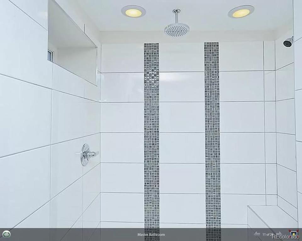 3217 Lawrence Street Denver, CO 80205 - Photo 5 of 13 a bathroom with a shower