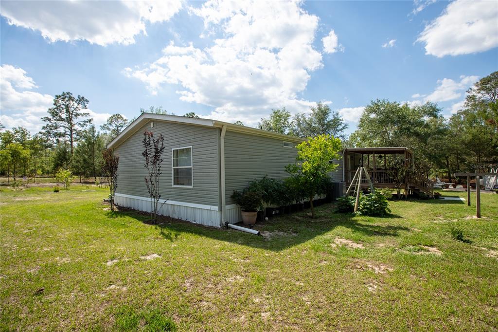 5670 Acadia Street Keystone Heights, FL 32656 - Photo 9 of 65 a view of a house with backyard and sitting area