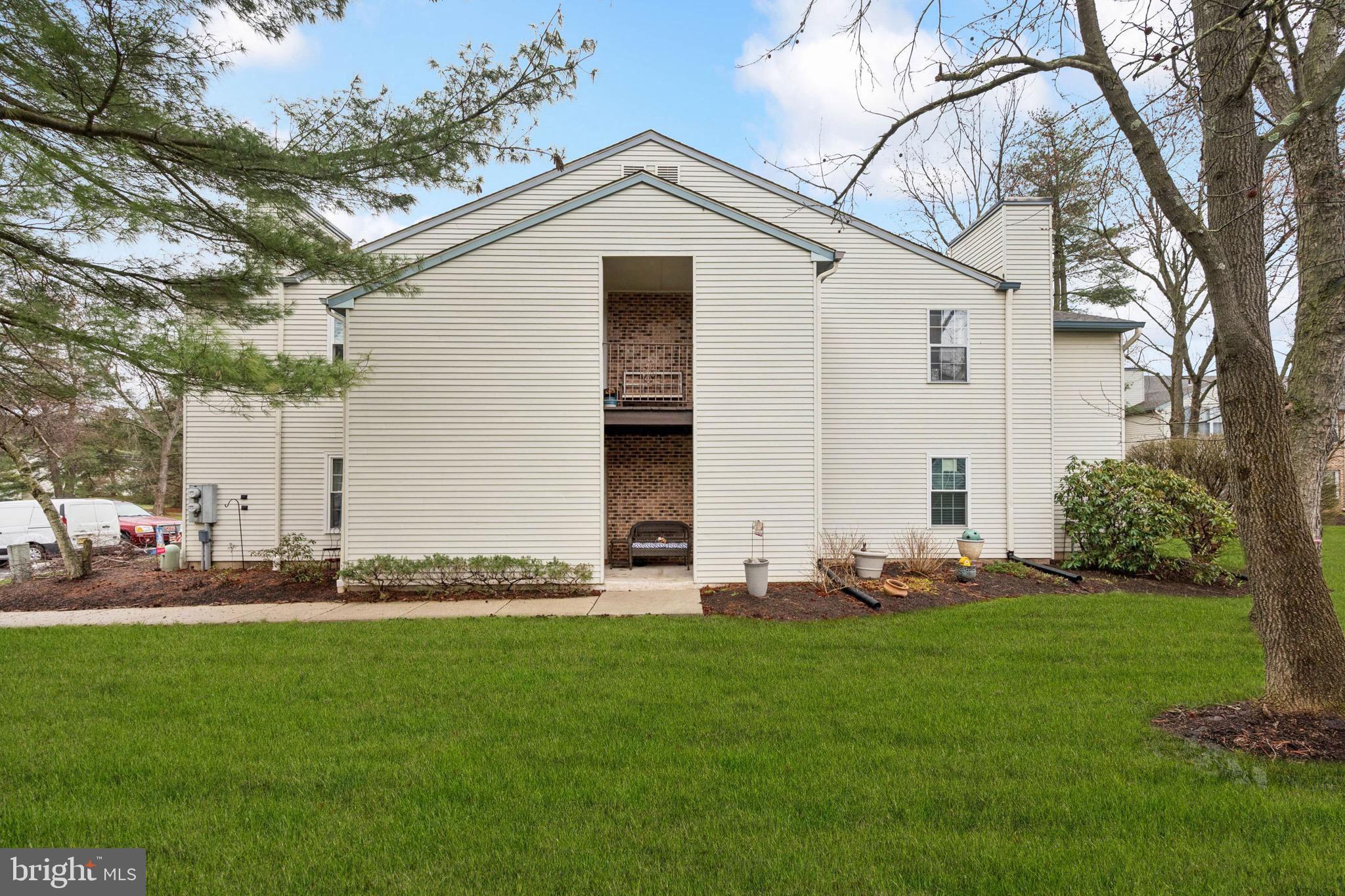 112 Village Lane Mount Laurel, NJ 08054 - Photo 1 of 17 a front view of house with yard