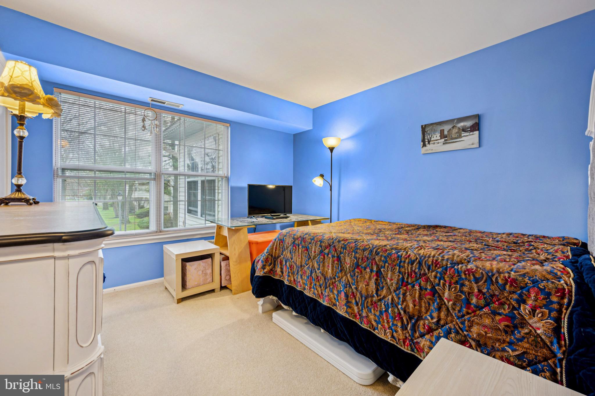 112 Village Lane Mount Laurel, NJ 08054 - Photo 14 of 17 a bed sitting in a bedroom next to a window