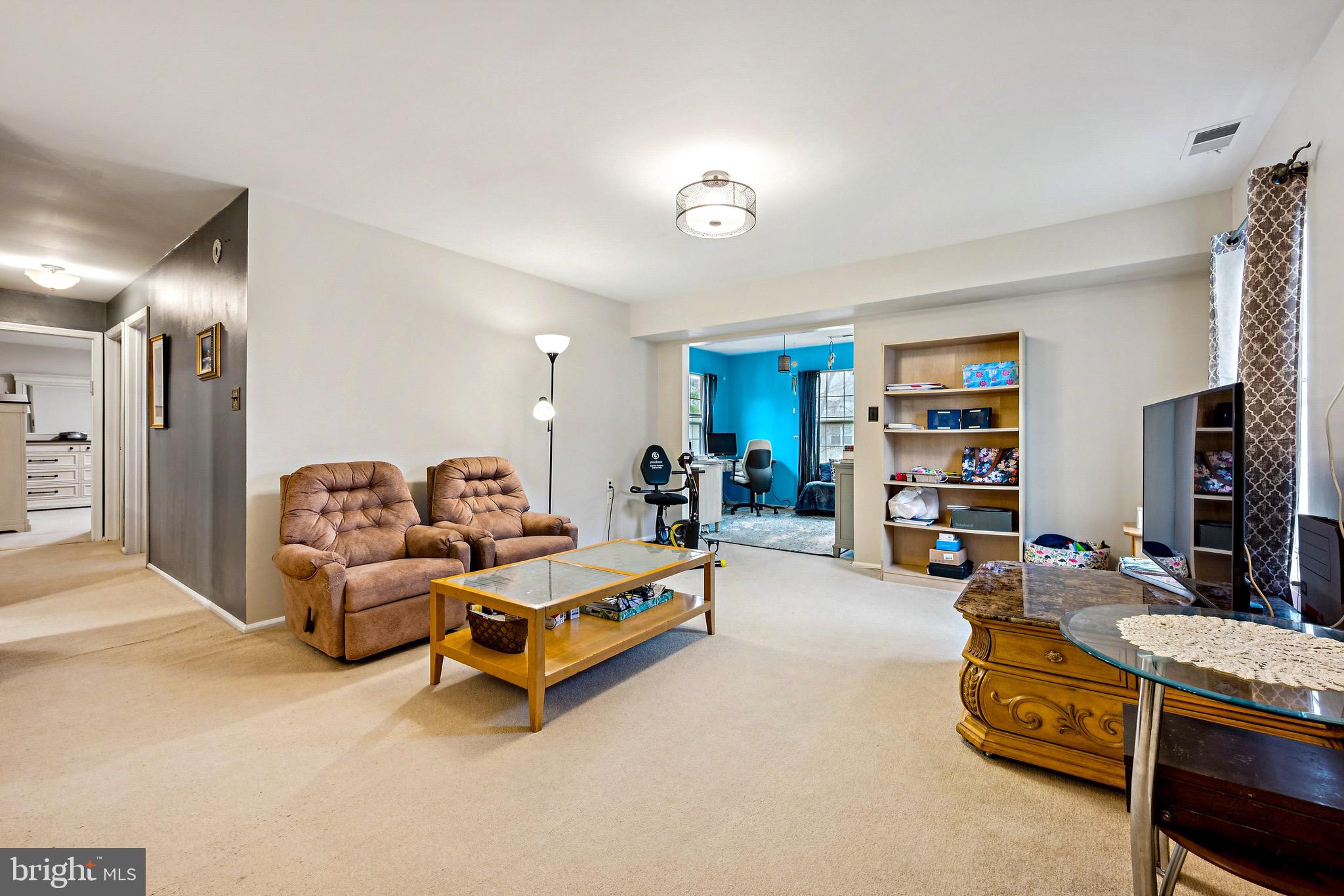 112 Village Lane Mount Laurel, NJ 08054 - Photo 2 of 17 a living room with furniture and a lamp