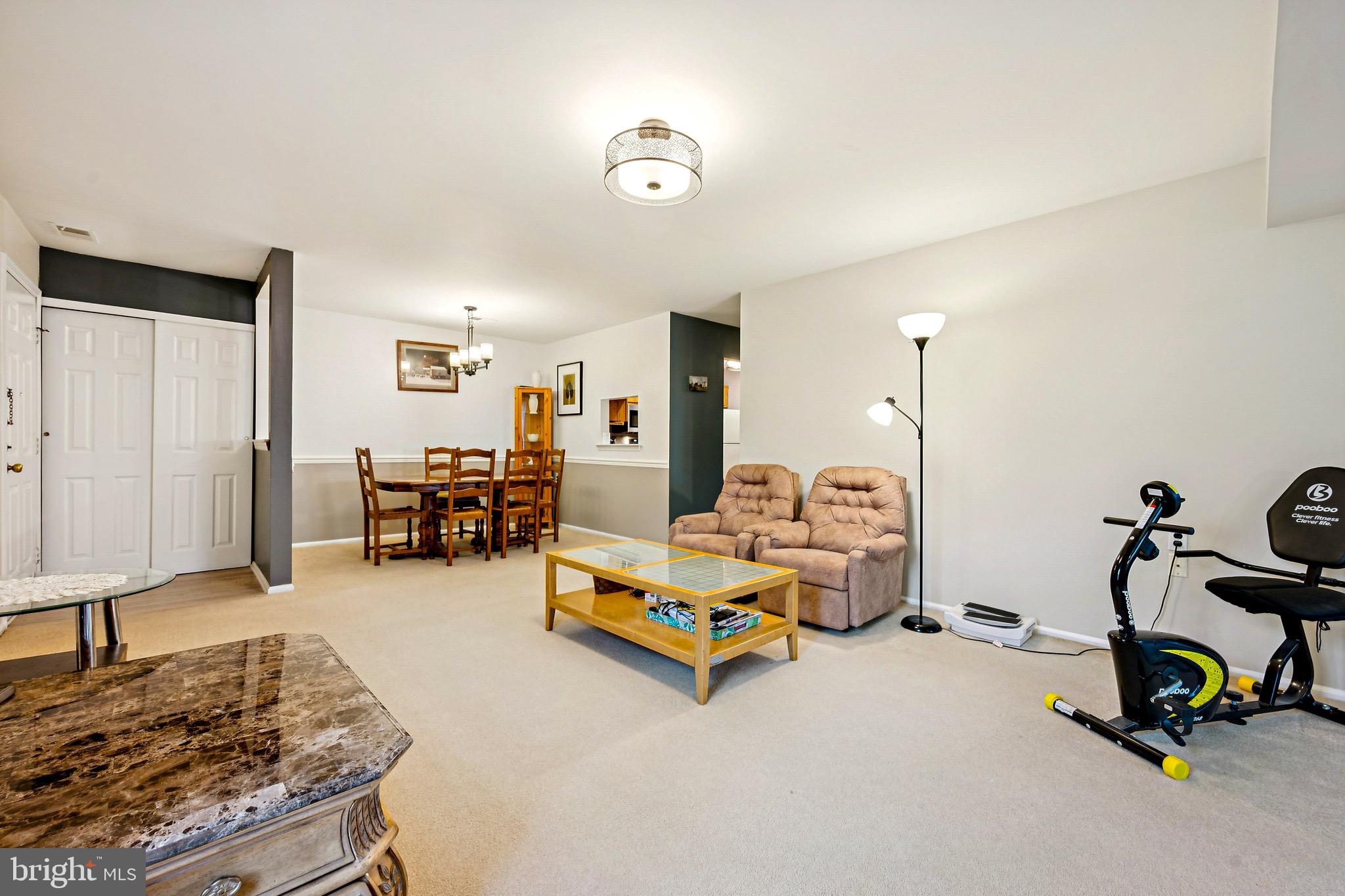 112 Village Lane Mount Laurel, NJ 08054 - Photo 4 of 17 a room with gym equipment and a table
