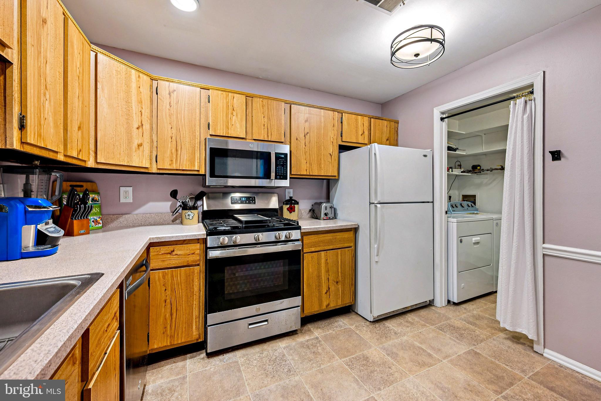 112 Village Lane Mount Laurel, NJ 08054 - Photo 8 of 17 a kitchen with a refrigerator stove and microwave