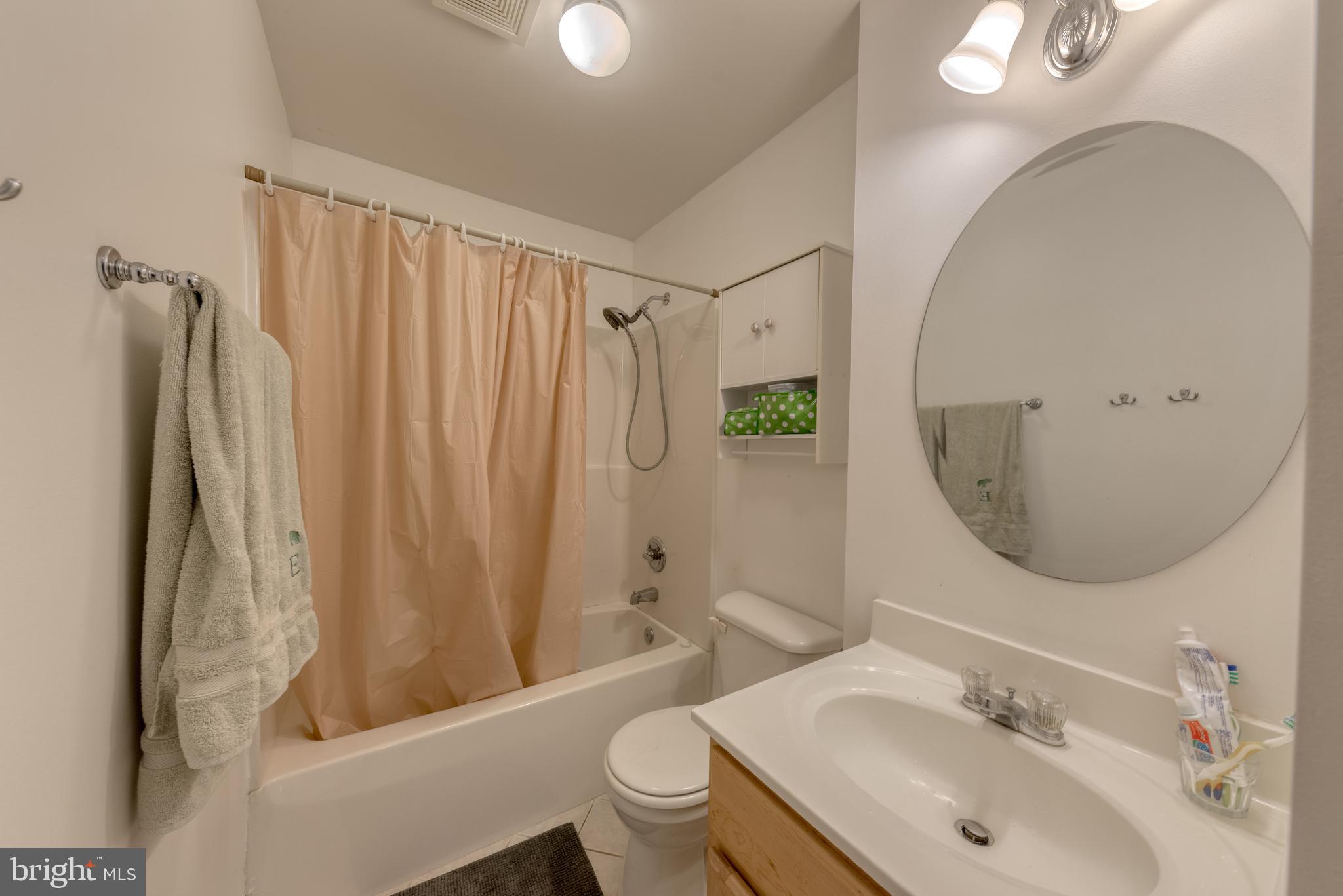 1818 Bank Street Baltimore, MD 21231 - Photo 11 of 20 a bathroom with a sink toilet and shower