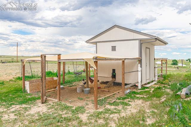 11170 Peaceful Valley Road Colorado Springs, CO 80925 - Photo 34 of 49 View of poultry coop featuring a view of countryside