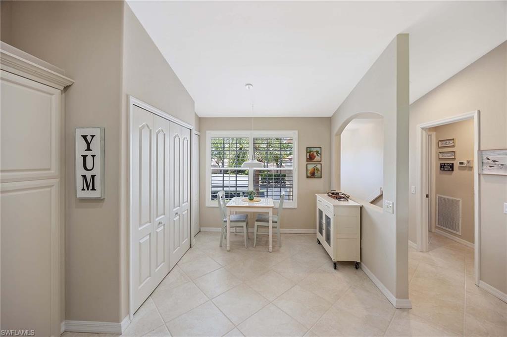 9030 Spring Run Boulevard, Unit 508 Estero, FL 34135 - Photo 13 of 41 a view of a hallway with living room and dining room