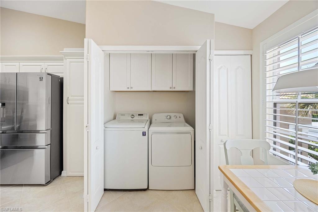 9030 Spring Run Boulevard, Unit 508 Estero, FL 34135 - Photo 20 of 41 a utility room with dryer and washer