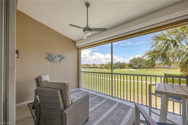 a view of a balcony with furniture