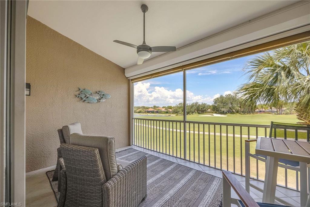 9030 Spring Run Boulevard, Unit 508 Estero, FL 34135 - Photo 21 of 41 a view of a balcony with furniture