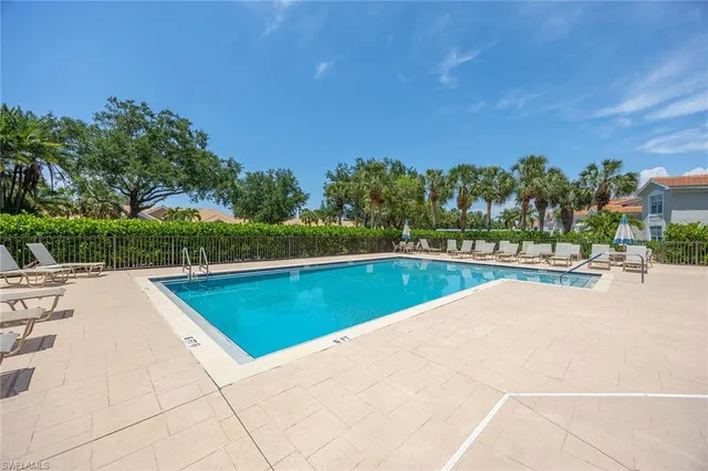 a view of a swimming pool with a patio