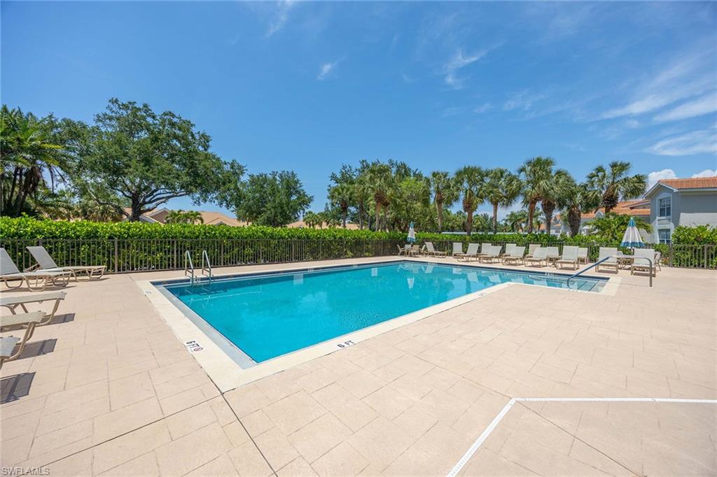 9030 Spring Run Boulevard, Unit 508 Estero, FL 34135 - Photo 26 of 41 a view of an outdoor space and swimming pool