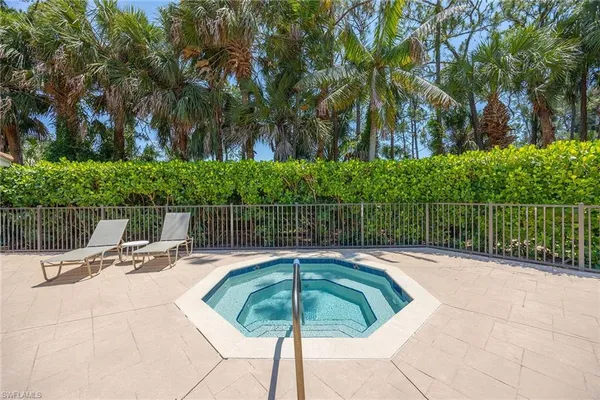 a view of swimming pool with seating space
