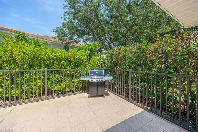 an aerial view of a house with a swimming pool yard and outdoor seating