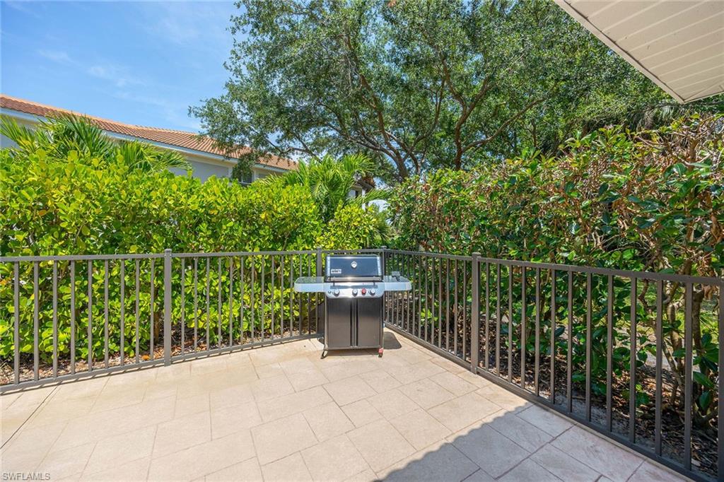 9030 Spring Run Boulevard, Unit 508 Estero, FL 34135 - Photo 29 of 41 a view of a balcony with chairs