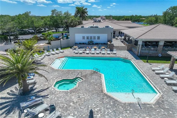swimming pool view with a outdoor seating