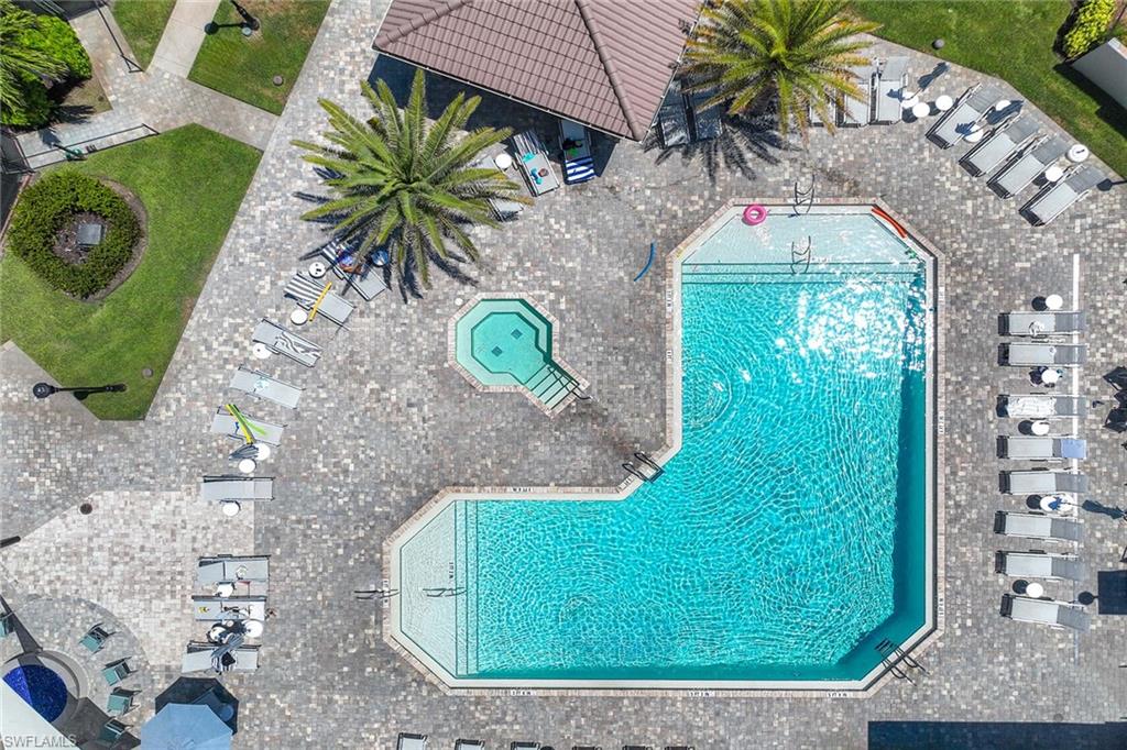 9030 Spring Run Boulevard, Unit 508 Estero, FL 34135 - Photo 35 of 41 swimming pool view with a outdoor seating