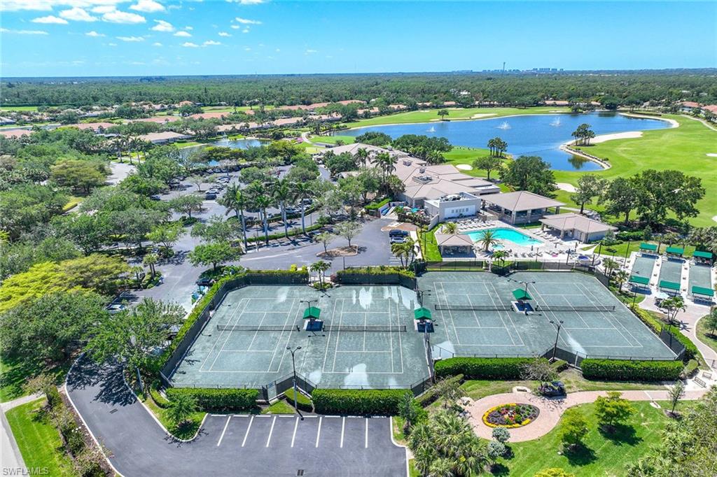 9030 Spring Run Boulevard, Unit 508 Estero, FL 34135 - Photo 37 of 41 a view of a city with lots of trees and houses in the back