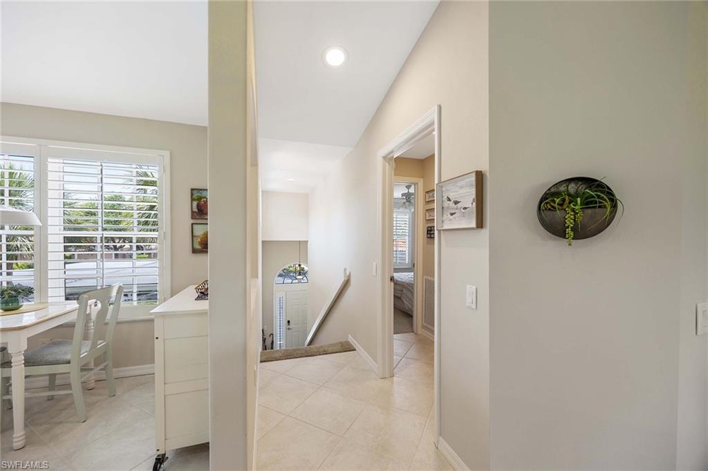 9030 Spring Run Boulevard, Unit 508 Estero, FL 34135 - Photo 4 of 41 a living room with furniture and a large window