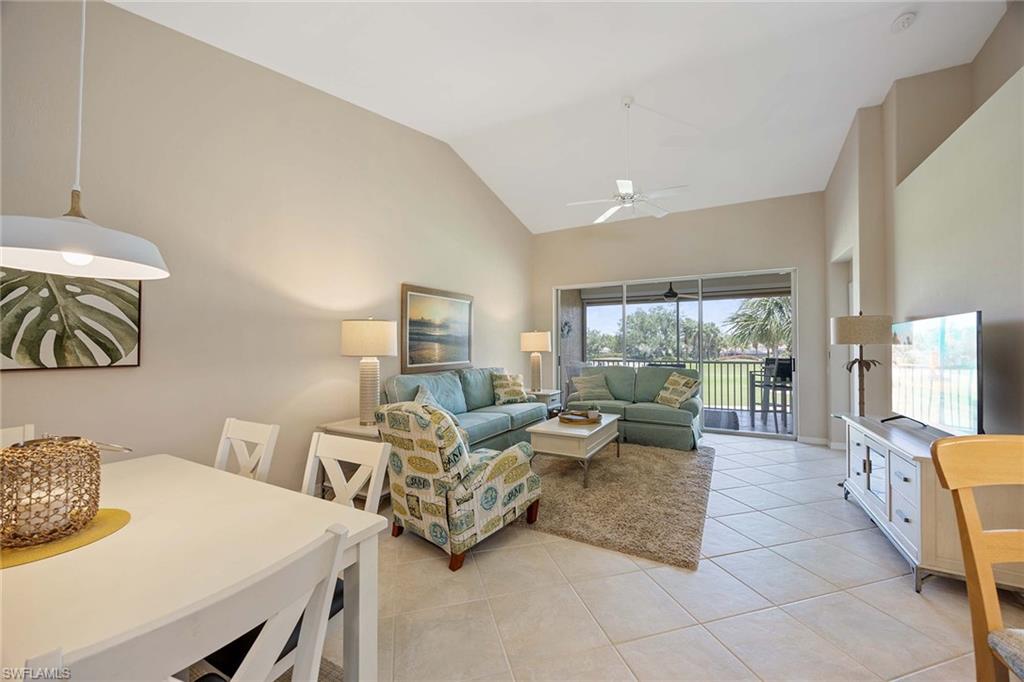 9030 Spring Run Boulevard, Unit 508 Estero, FL 34135 - Photo 5 of 41 a living room with furniture and a large window