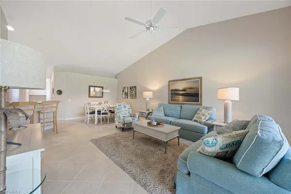 a living room with furniture and white walls