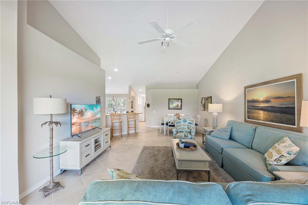 9030 Spring Run Boulevard, Unit 508 Estero, FL 34135 - Photo 9 of 41 a living room with furniture and a flat screen tv