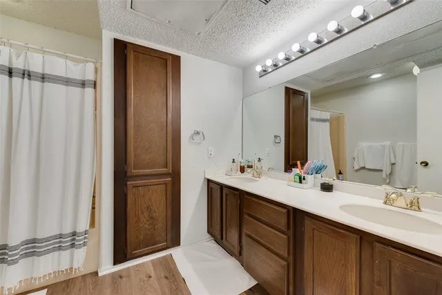 a bathroom with a double vanity sink mirror and double