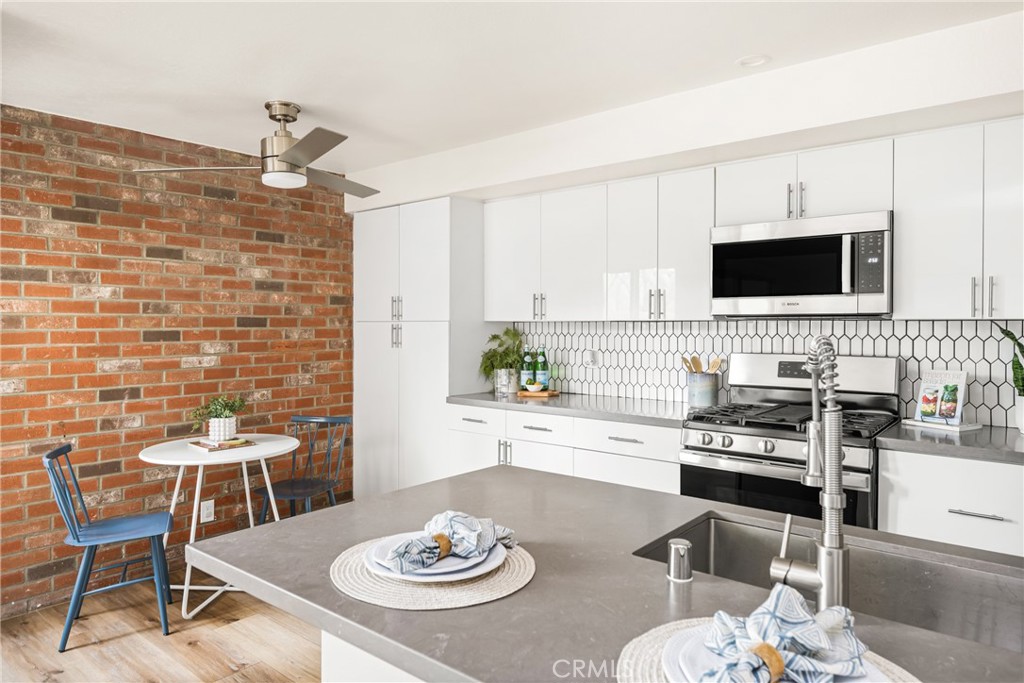1538 Windsor Lane Fullerton, CA 92831 - Photo 14 of 40 a view of a dining room with furniture and wooden floor