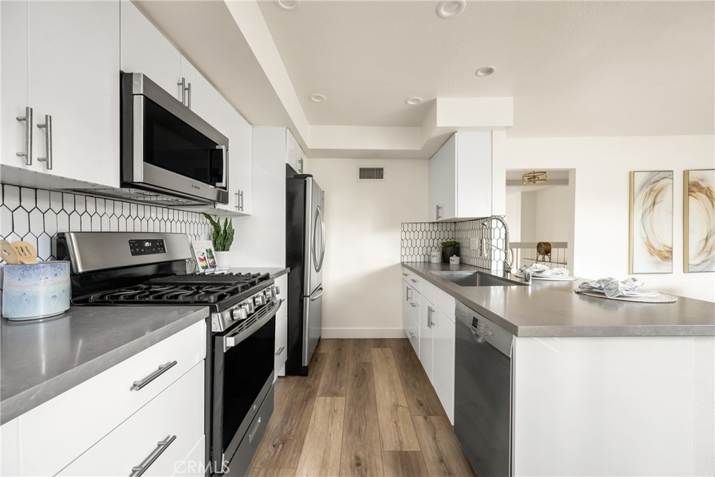 1538 Windsor Lane Fullerton, CA 92831 - Photo 15 of 40 a kitchen with stainless steel appliances granite countertop a stove and a sink