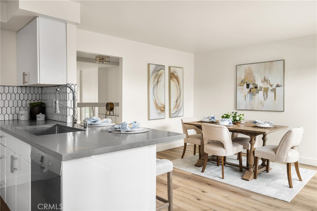 1538 Windsor Lane Fullerton, CA 92831 - Photo 17 of 40 a dining hall with stainless steel appliances granite countertop a dining table and chairs with wooden floor