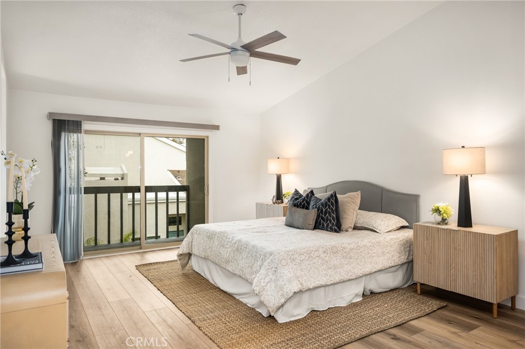 1538 Windsor Lane Fullerton, CA 92831 - Photo 21 of 40 a bedroom with a large bed and a chandelier fan