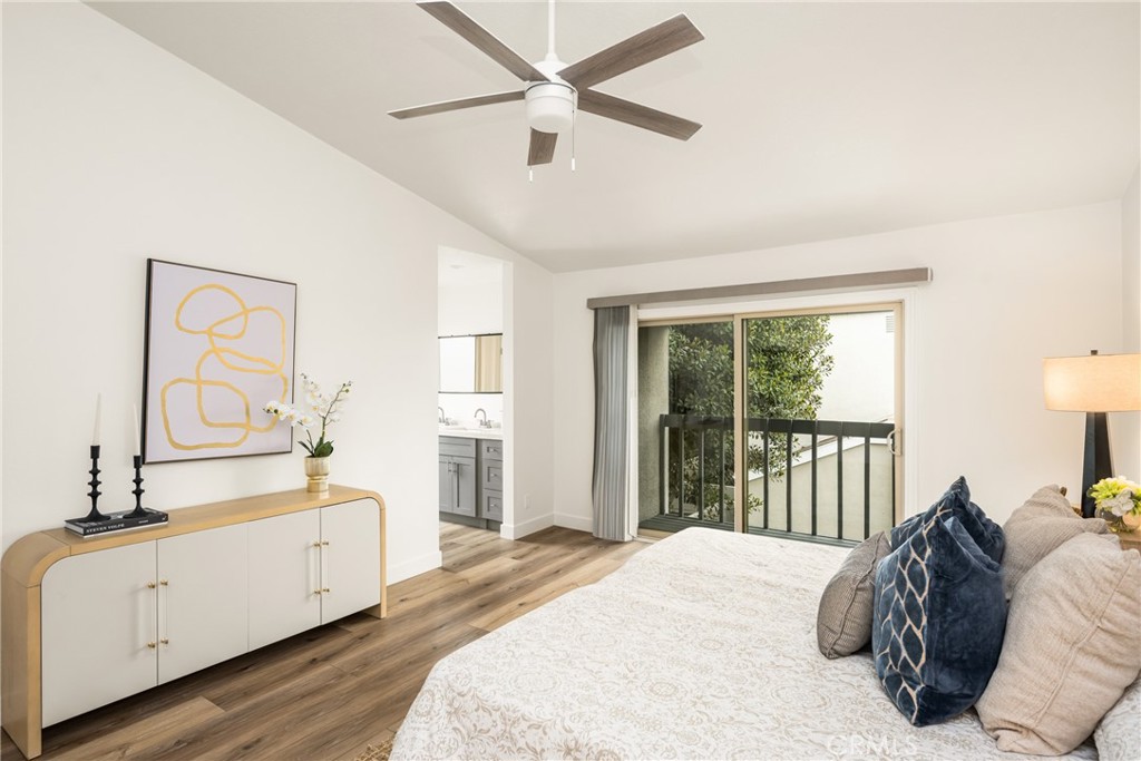 1538 Windsor Lane Fullerton, CA 92831 - Photo 22 of 40 a spacious bedroom with a bed and a chandelier